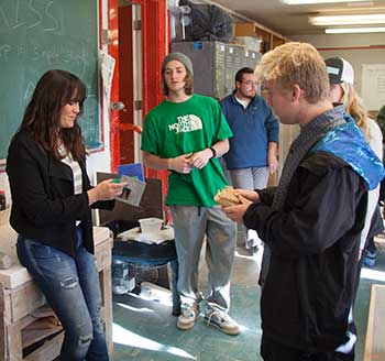 professor and students in a ceramics class