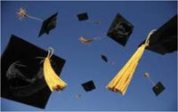 photo of mortarboard caps thrown into the air