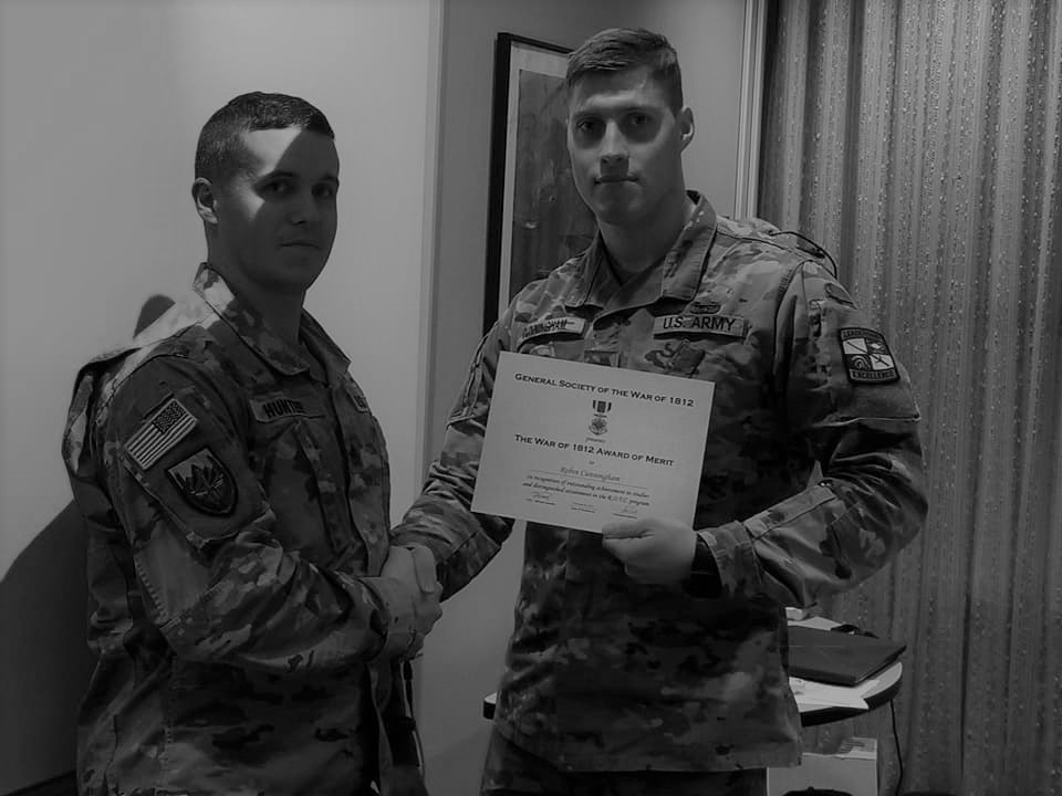 Cadet Cunningham receiving an award