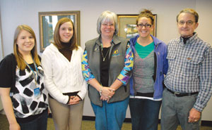 Jackets and Company staff with Big Brothers Big Sisters representative