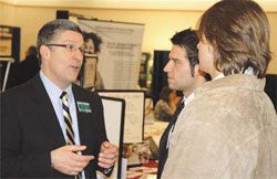 photo of an employer and students at last years career fair