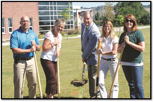 Rod Ostermiller and Paulette Bentz, from the Exchange Clubs of Billings, at left, joined MSU Billings Chancellor Rolf Groseth, center, and Stockman Bank employees Erin Ferrell and Tricia Hansen to break ground for the project