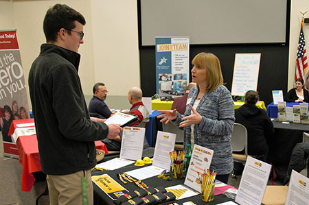 Saul Vacca,18, left, discusses possible job opportunities with Human Resources Director Geri Kinsfather