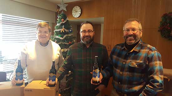 Bill, Paul and Kevin with bottles of Yellowjacket Ale