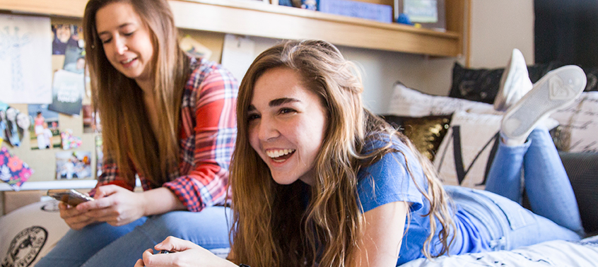 Students lounging in a dorm room