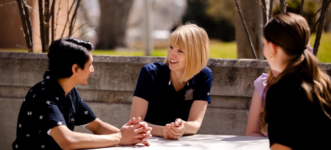 Chancellor Hicswa listening to a freshman 