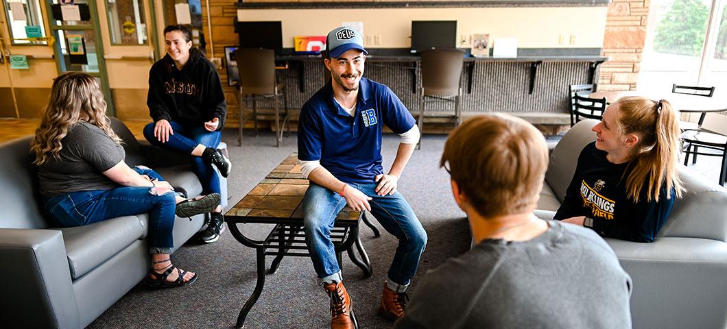 Students meet in a lounge area.