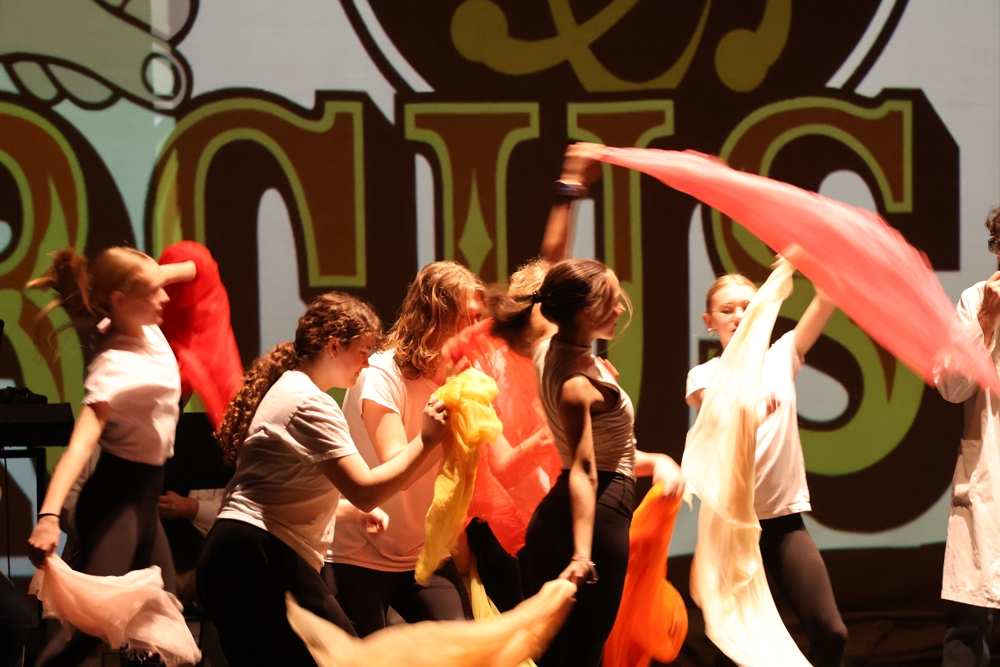 students dance with scarves