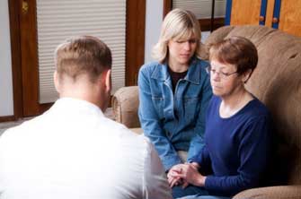 two people sitting on a couch