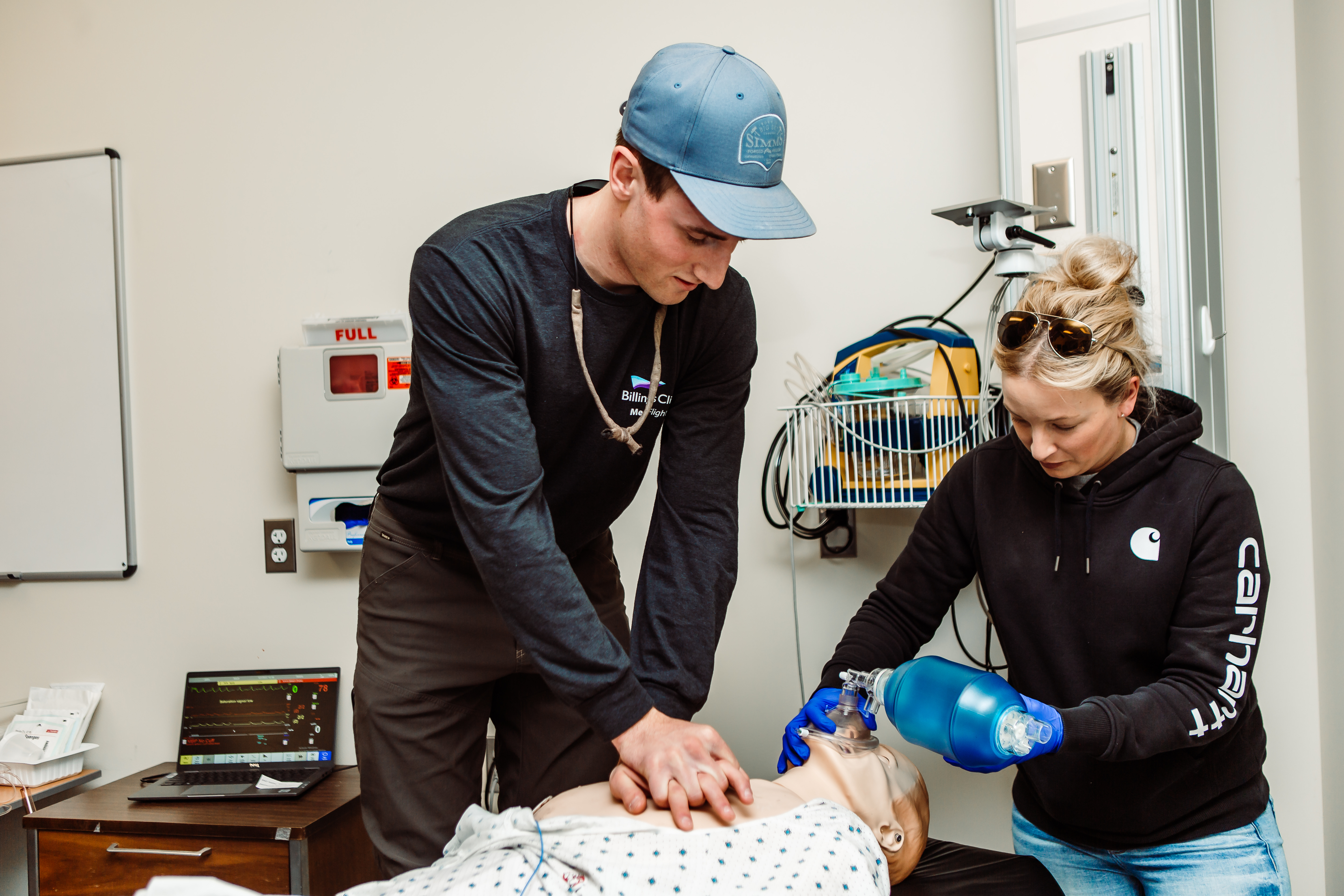 CNA students with a medical dummy CNA students with a medical dummy