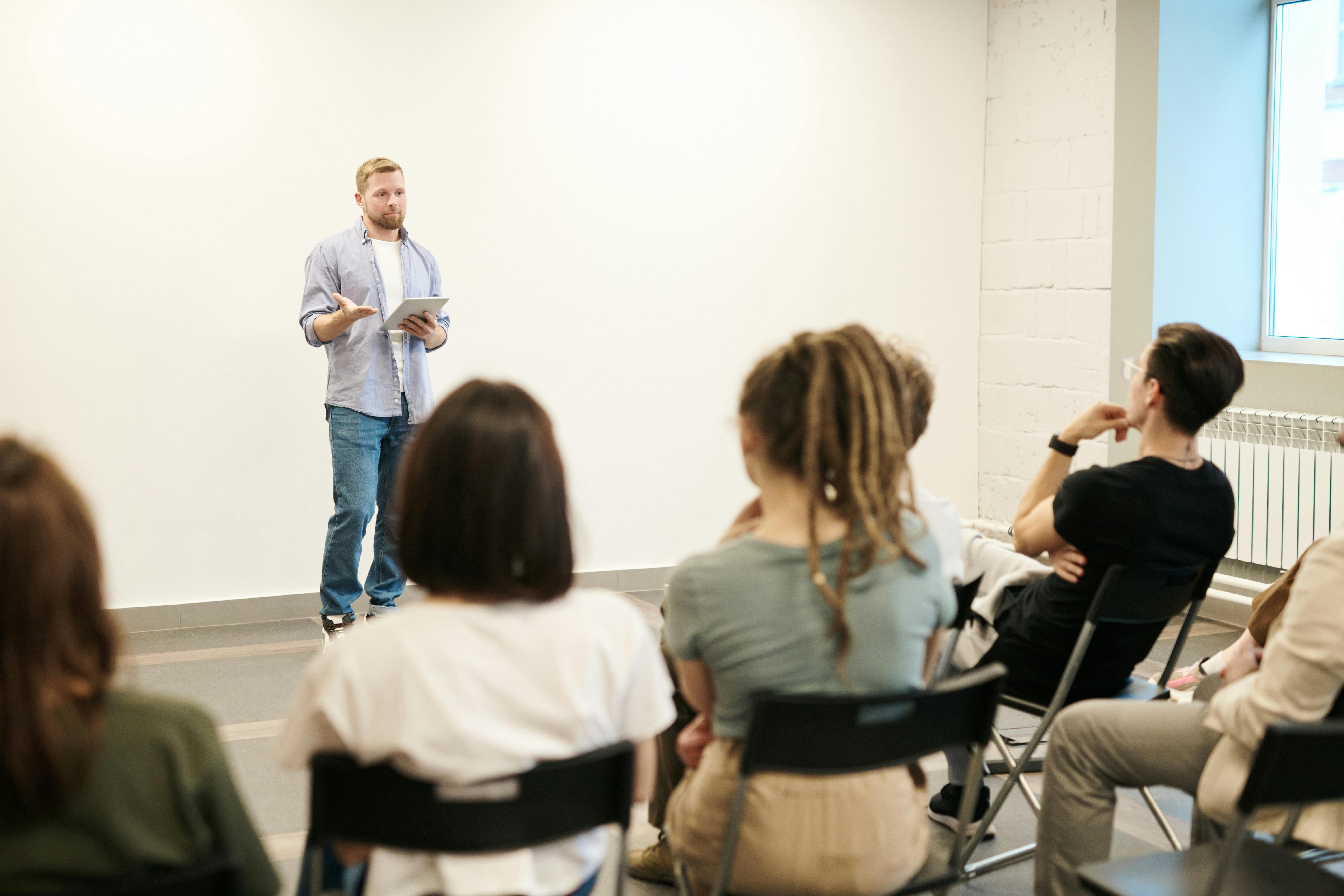 Man presents to a classroom
