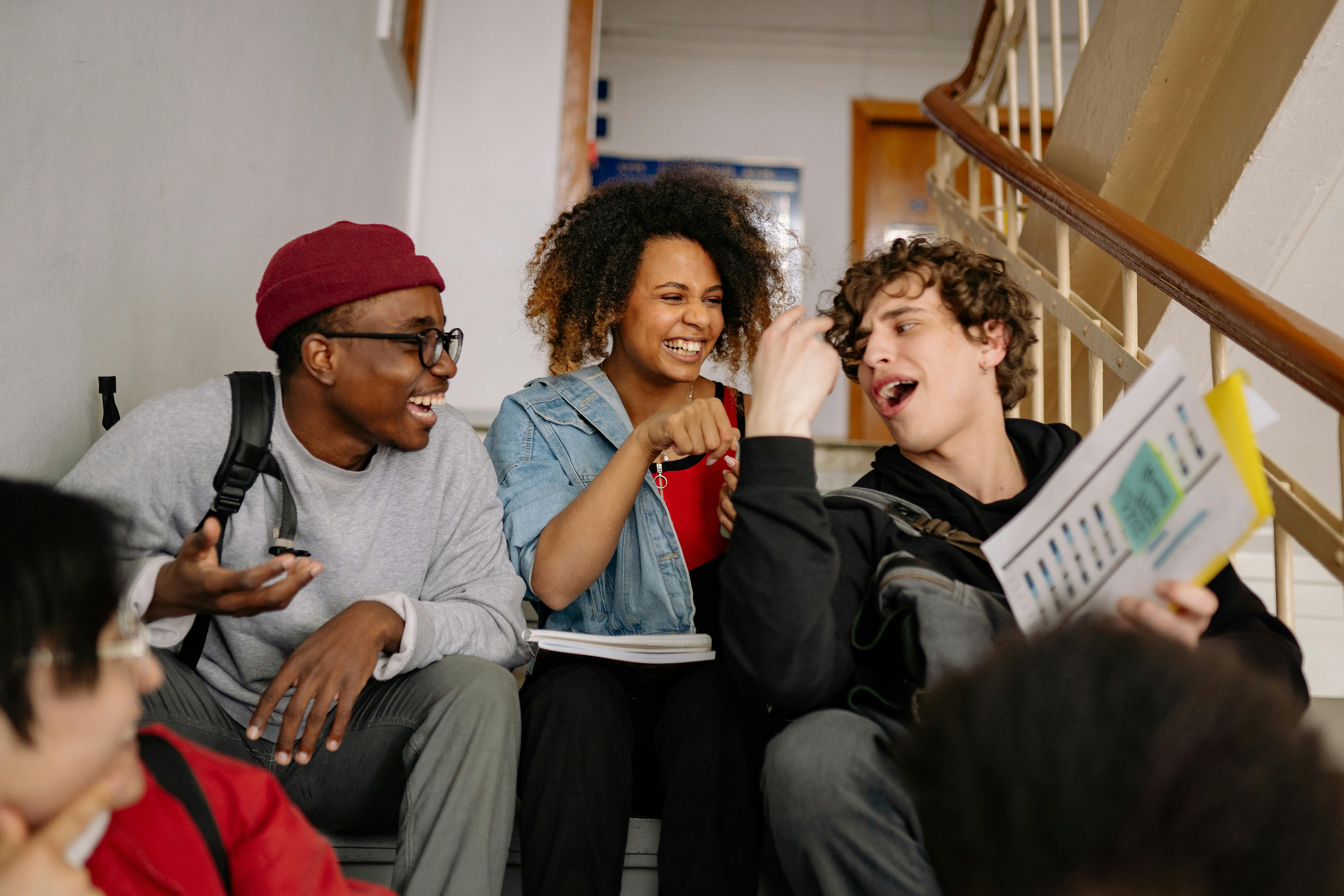 Group of students laughing on stairs