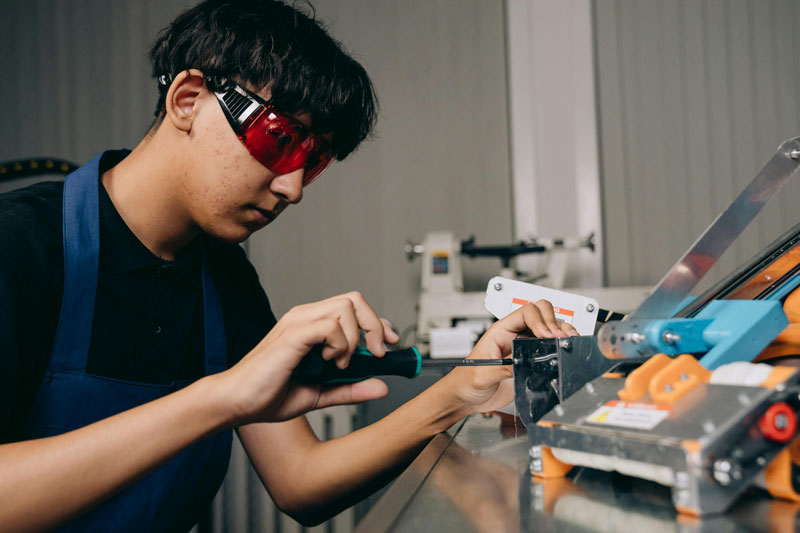 Teen working on electrical equipment