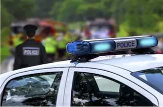 a police car with lights flashing at a crime scene