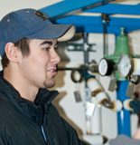a COT student working in the process plant lab