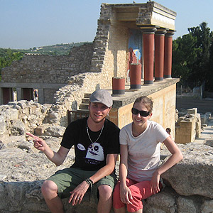 Student posing in front of ancient structure