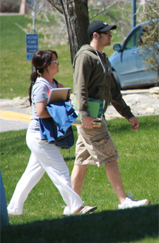 two students cross the MSUB campus in early spring