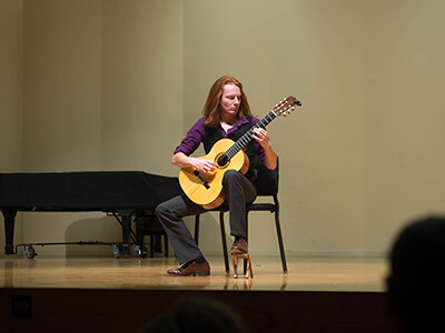 guitar music student on the Cisel Hall stage