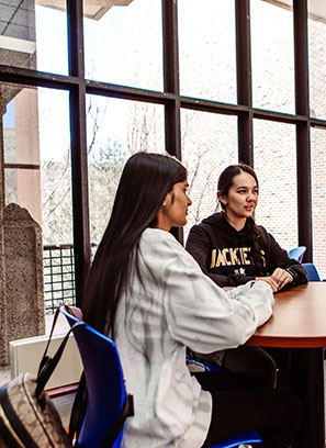 woman signing paperwork