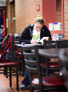 student studying in the LA Express cafe on the main MSU Billings campus