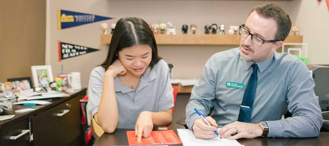 A counselor meets with a student