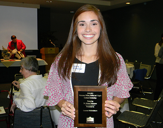 Laura Nicholson with an award