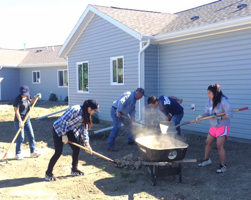 International students volunteering at Habitat for Humanity