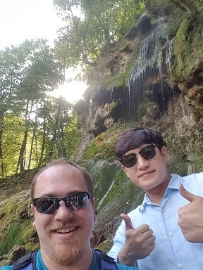 MSUB Student David Ballew in front of waterfall