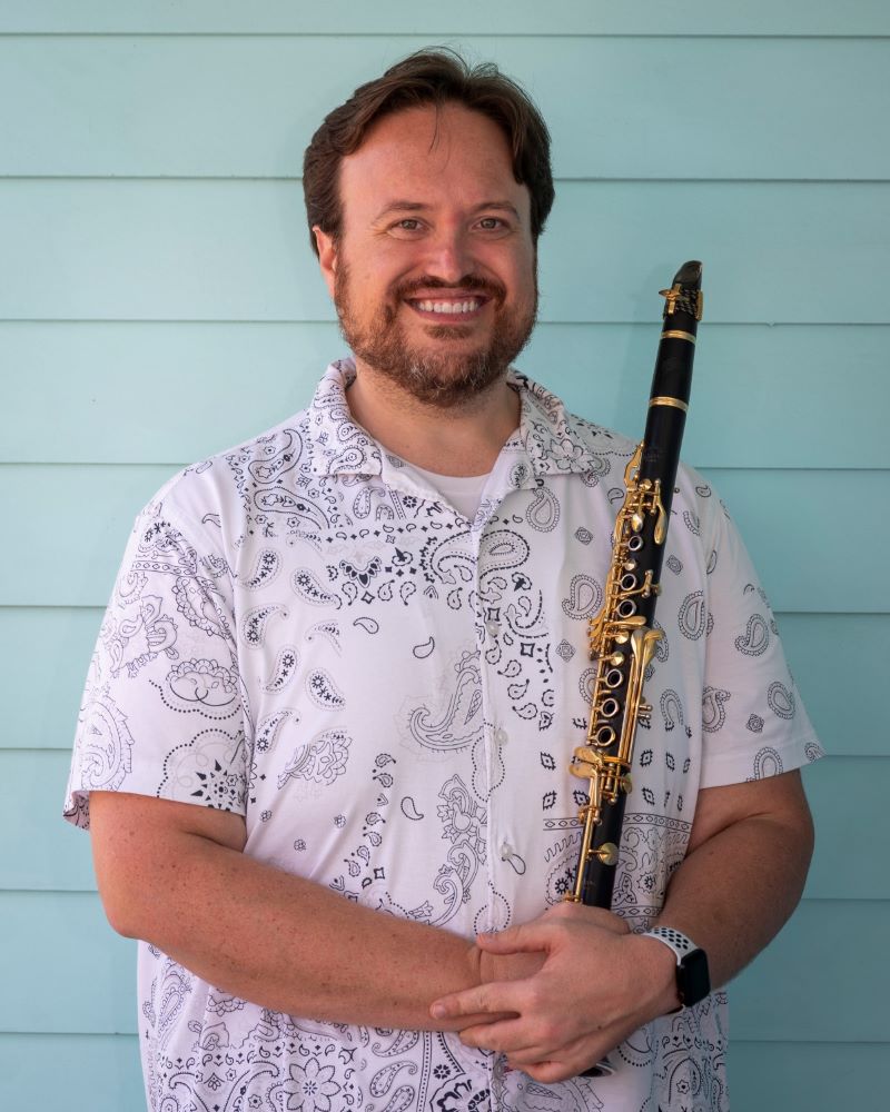 bandleader,Jory Woodis, holding clarinet