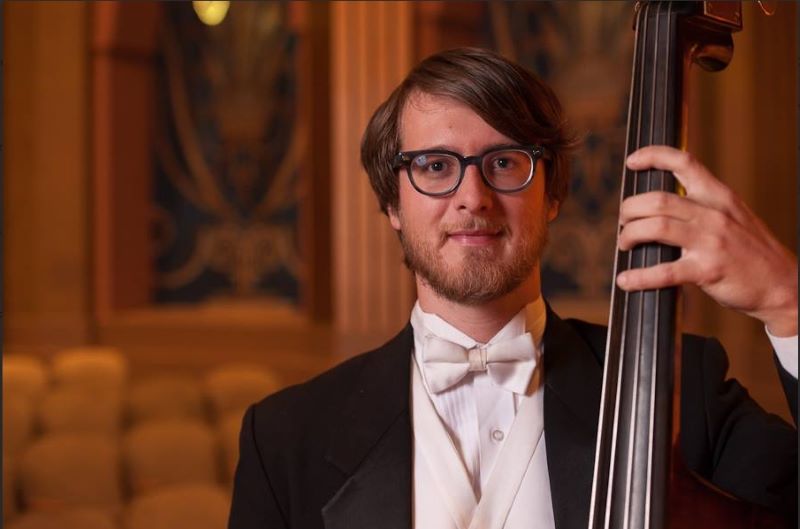 Taylor Kent in tuxedo playing string bass