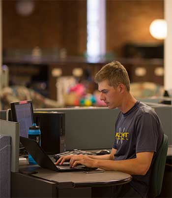 a student doing research in the MSUB library