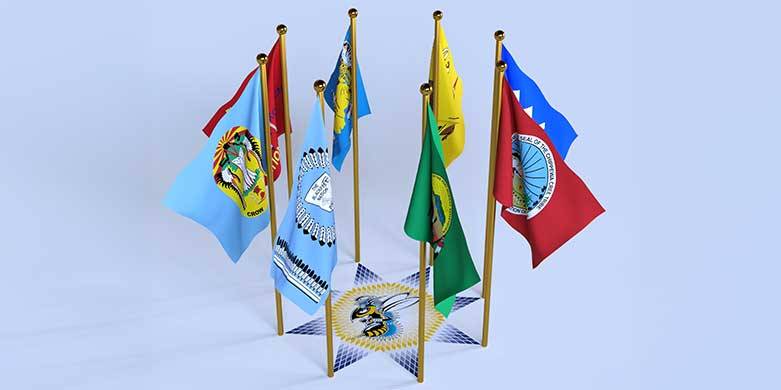 The flags of the Fort Peck Tribes, Northern Cheyenne Tribal Nation, Crow Tribal Nation, Fort Belknap Tribal Nation, Confederated Salish and Kootenai Tribal Nation, Blackfeet Tribal Nation, Little Shell Chippewa Tribal Nation, and Chippewa Cree Tribal Nation are arranged around the eight points of a star quilt design