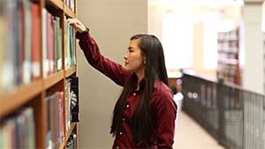 a student of color in a library