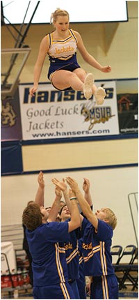 MSUB Cheer team performing a stunt