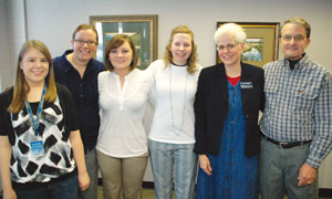 Jackets and Company crew with Habitat for Humanity representatives