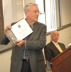 Chancellor Ron Sexton and, in the background, Dean Gary Young, announcing the accreditation of the College of Business at MSUB