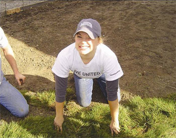 Kelsey, MSUB freshman, laying sod