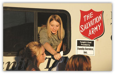 an MSUB student serves food to hungry Billings citizens