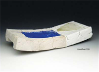 an abstract, rectangular piece of pottery