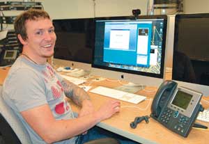 Ambrose at his computer