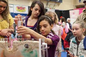 girls doing experiments at Chicks in Science 2012