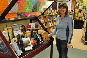 Eileen Wright at the MSUB Library with book display