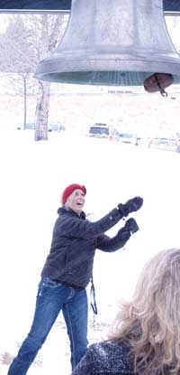 a student ringing the campus bell during MLK ceremonies