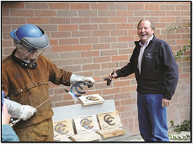 Gov. Schweitzer and welding instructor