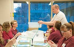 Shelton, a City College graduate, helping students with conputer networking