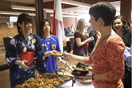 International students serve Japanese cuisine to community members