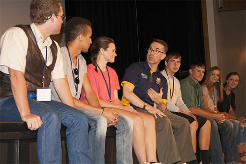 Joe Oravecz talking with students