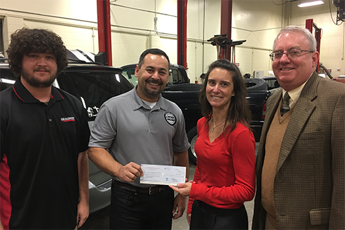 Chris Marron presents check