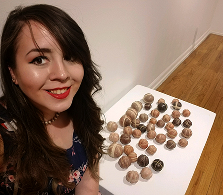 Jenna Livingston grabbing a quick selfie with her work before the show/reception
