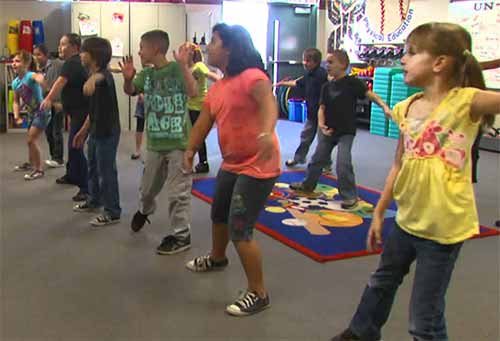 students exercising in the classroom